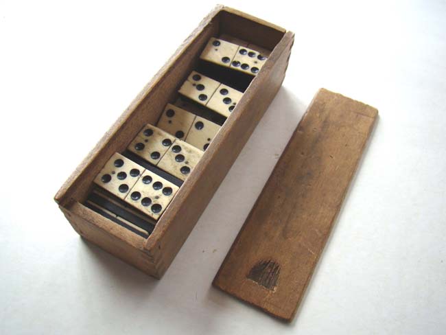 A nice boxed set of Civil War era bone and ebony dominoes circa 1860-1870